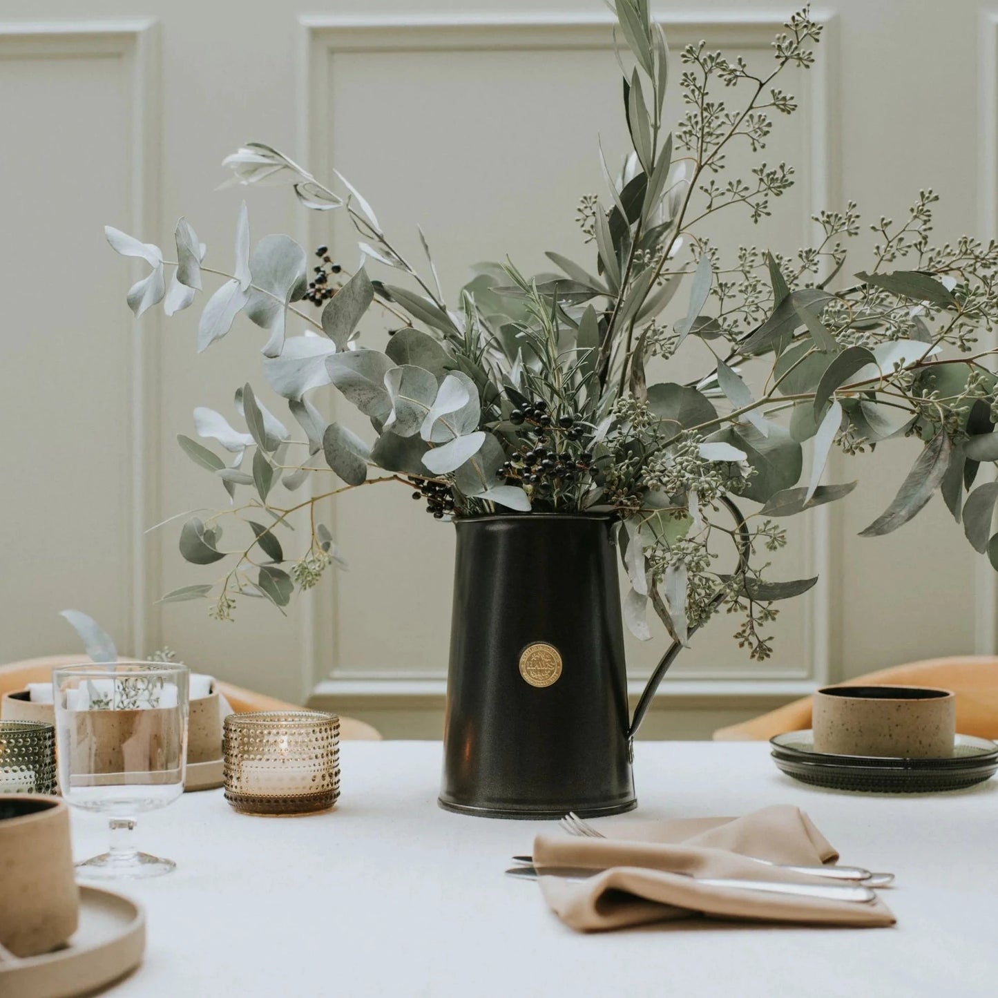 Haws Classic Jug in Graphite shown with a large branch flower arrangement