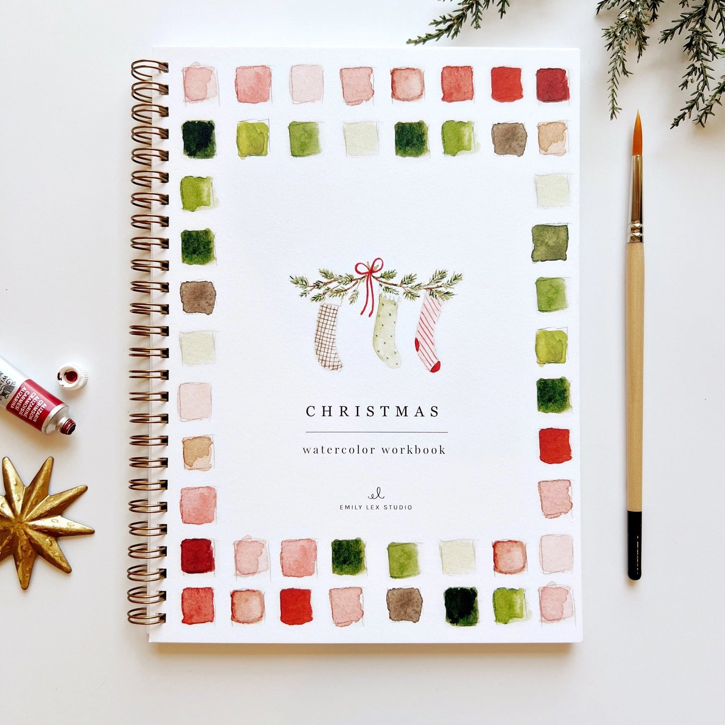 Front cover of Emily Lex Christmas Watercolor Workbook featuring festive holiday illustrations, watercolor paints, and seasonal charm.