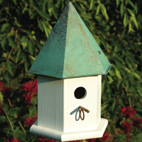 White bird house with copper roof