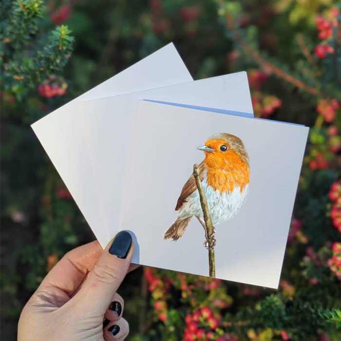 A picture of the watercolored mini Robin greeting card. The little Robin is setting on a branch. Beautiful colors.