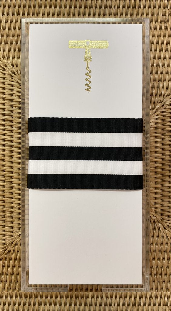 A photograph of the Corkscrew Buck note pad printed in gold.