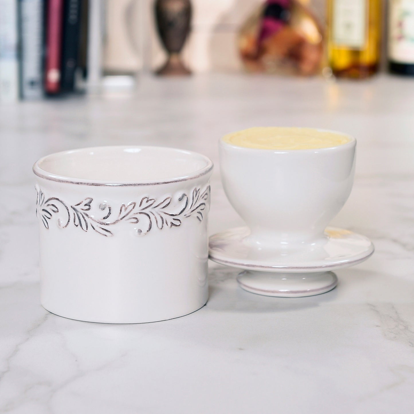 The Antique White Butter Bell with the lid off showing the bell shape with butter in it.