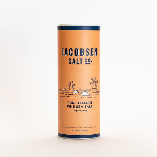 Picture of the Jacobsen Salt companies Pure Italian Fine Sea Salt harvested from Trapani Italy. it is a 1.8 oz canister