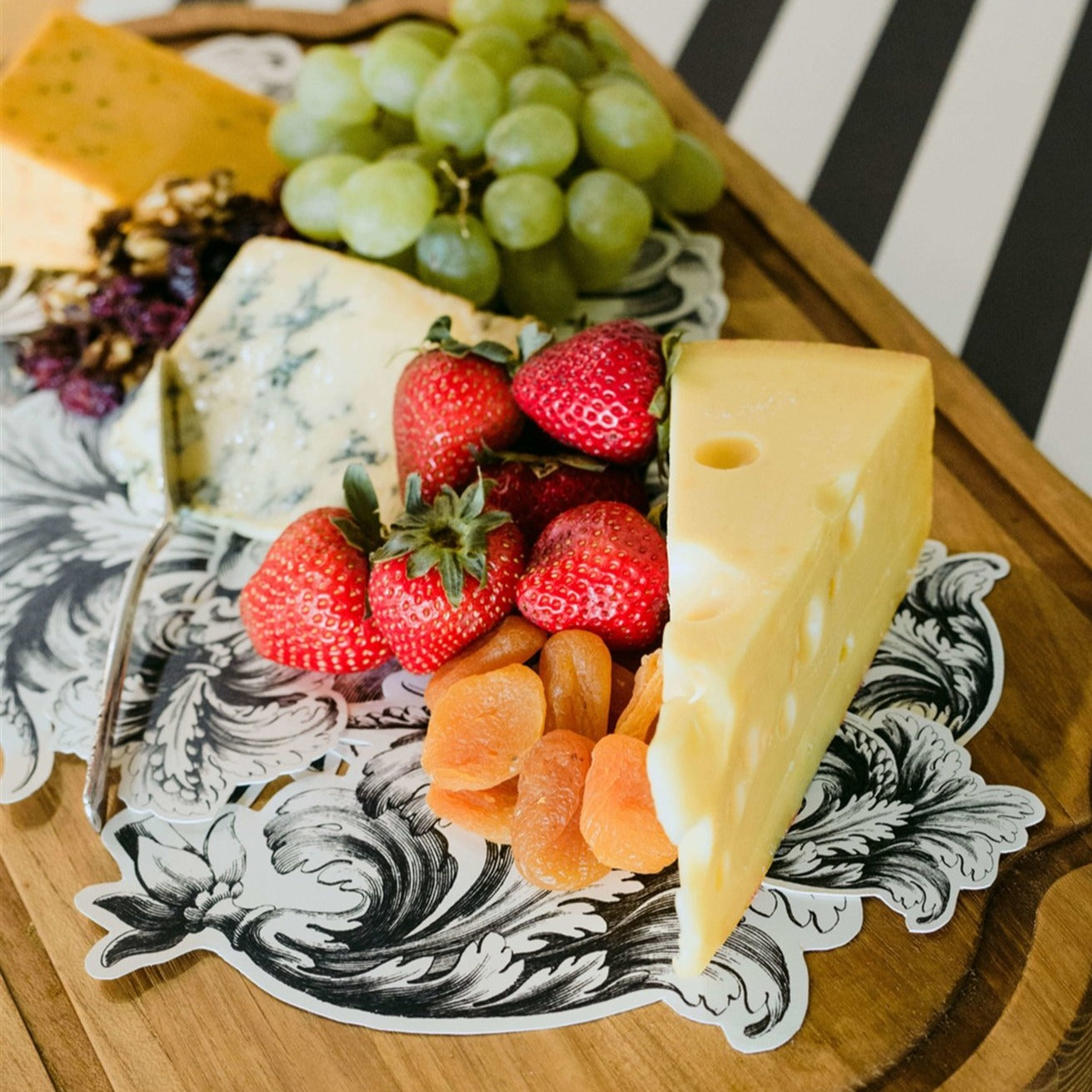 See the food serving paper in action with fruit and cheese placed on top