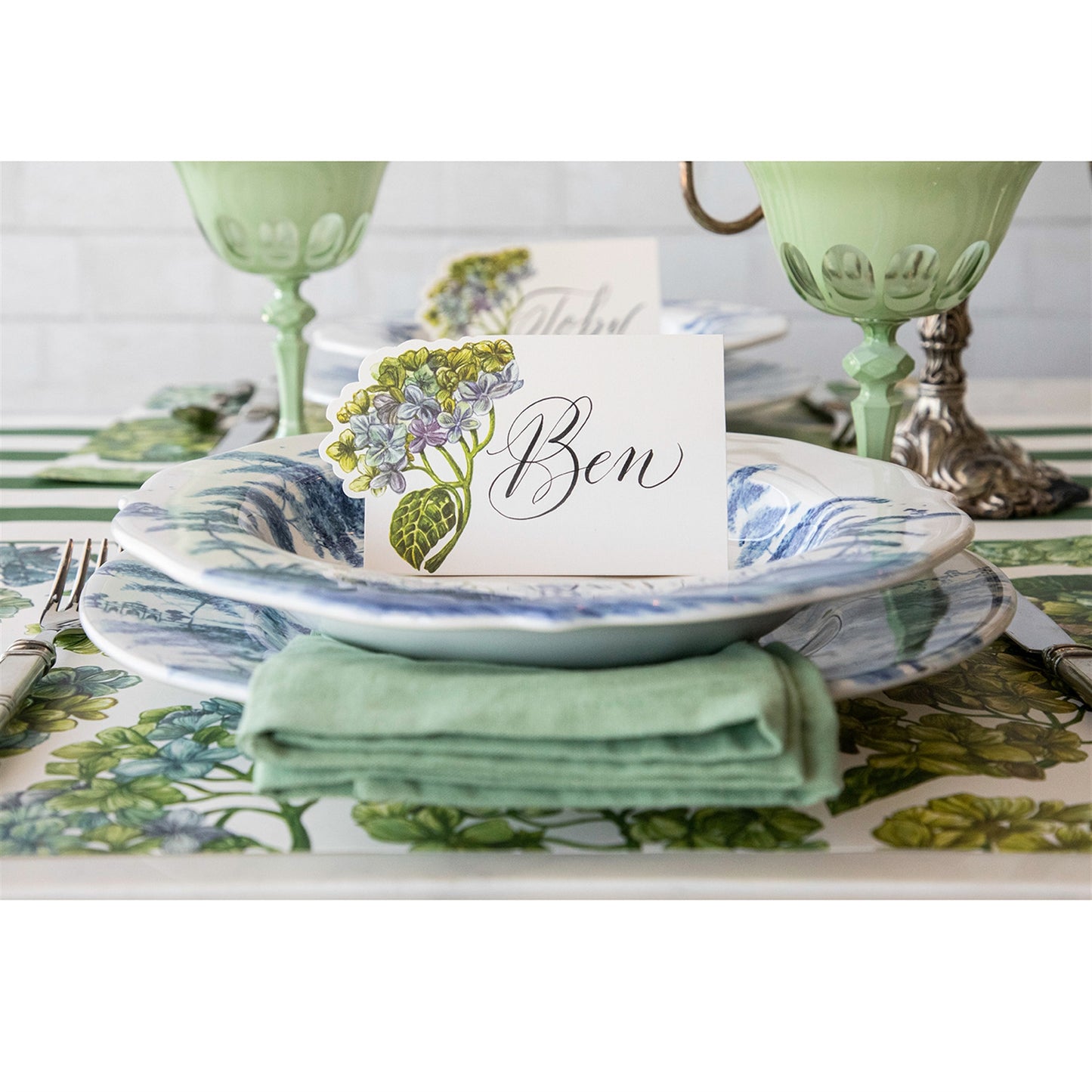 A close up of the Hydrangea place card used in a place setting.