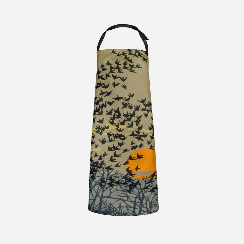 A picture of the Starlings Botanical Print Apron shown how it would look when worn.