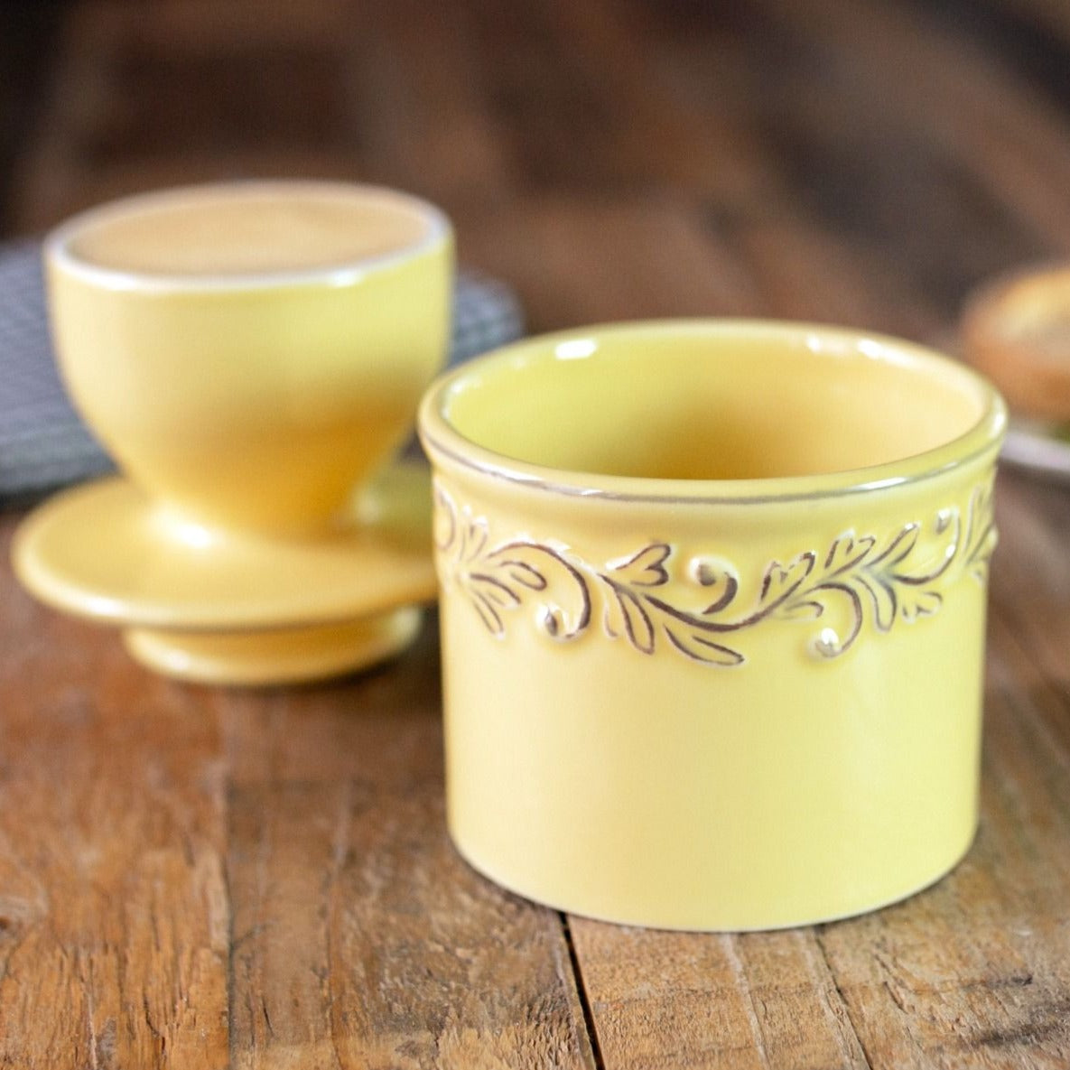 The Goldenrod Butter Bell with it's lid off showing the bell shape with butter in it.
