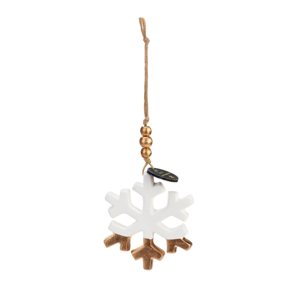This is a picture of the white snowflake ceramic diffuser ornament.  The lower part of the snowflake has been dipped in gold and is hanging from a string with gold beads and a small tag that says, " oh let it snow."