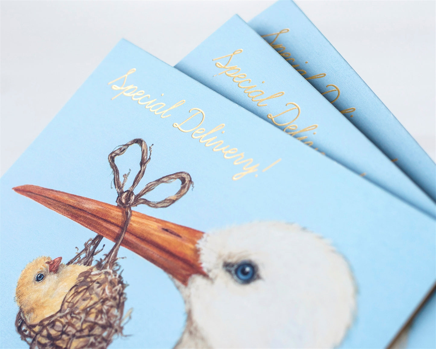 This picture is showing three special delivery cards stacked on-top of each other.