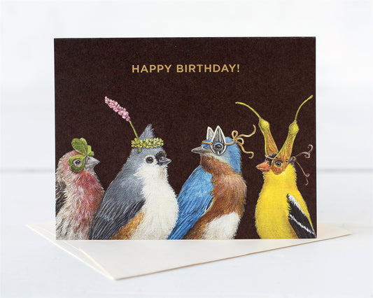 Four ladybirds dressed for a Birthday celebration wearing leaves, seeds and flowers as hats