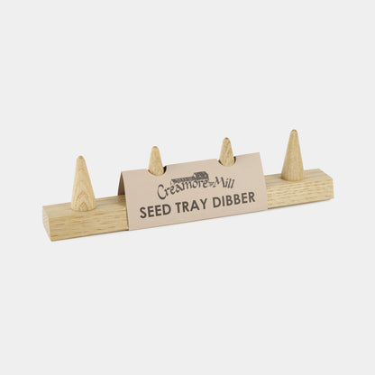 Creamore Mill Seed Tray Dibber in natural oak with four pointed pegs for evenly spaced seed sowing