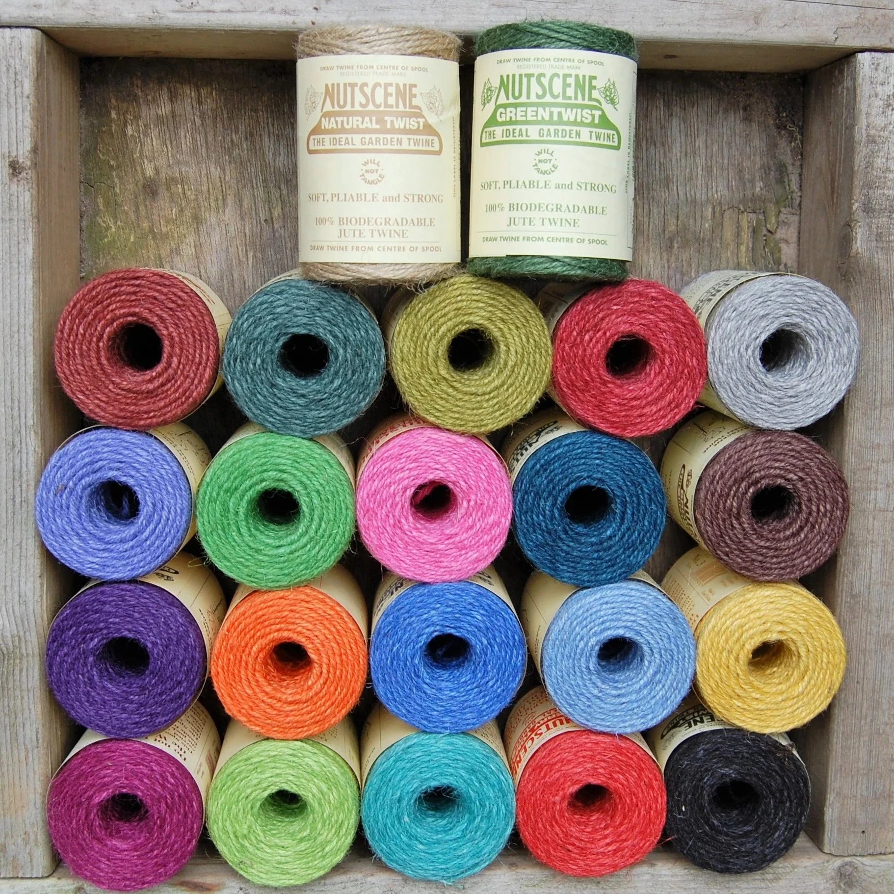 A wooden box showcasing the Nutscene Jute Garden Twine.