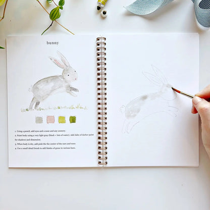 Emily lex workbook showing how to watercolor a rabbit.