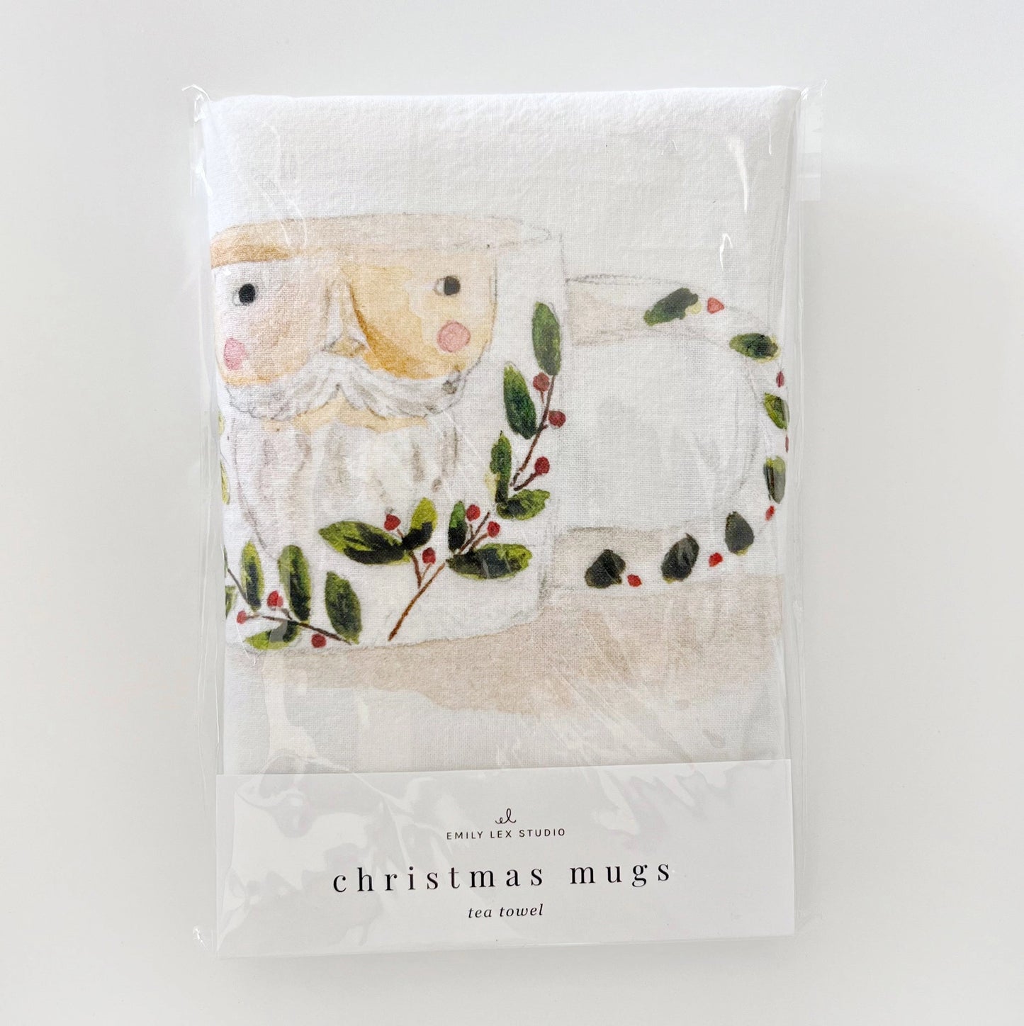 Emily Lex Christmas Mug Tea Towel featuring watercolor mugs of cocoa and candy canes, front package view of the package.