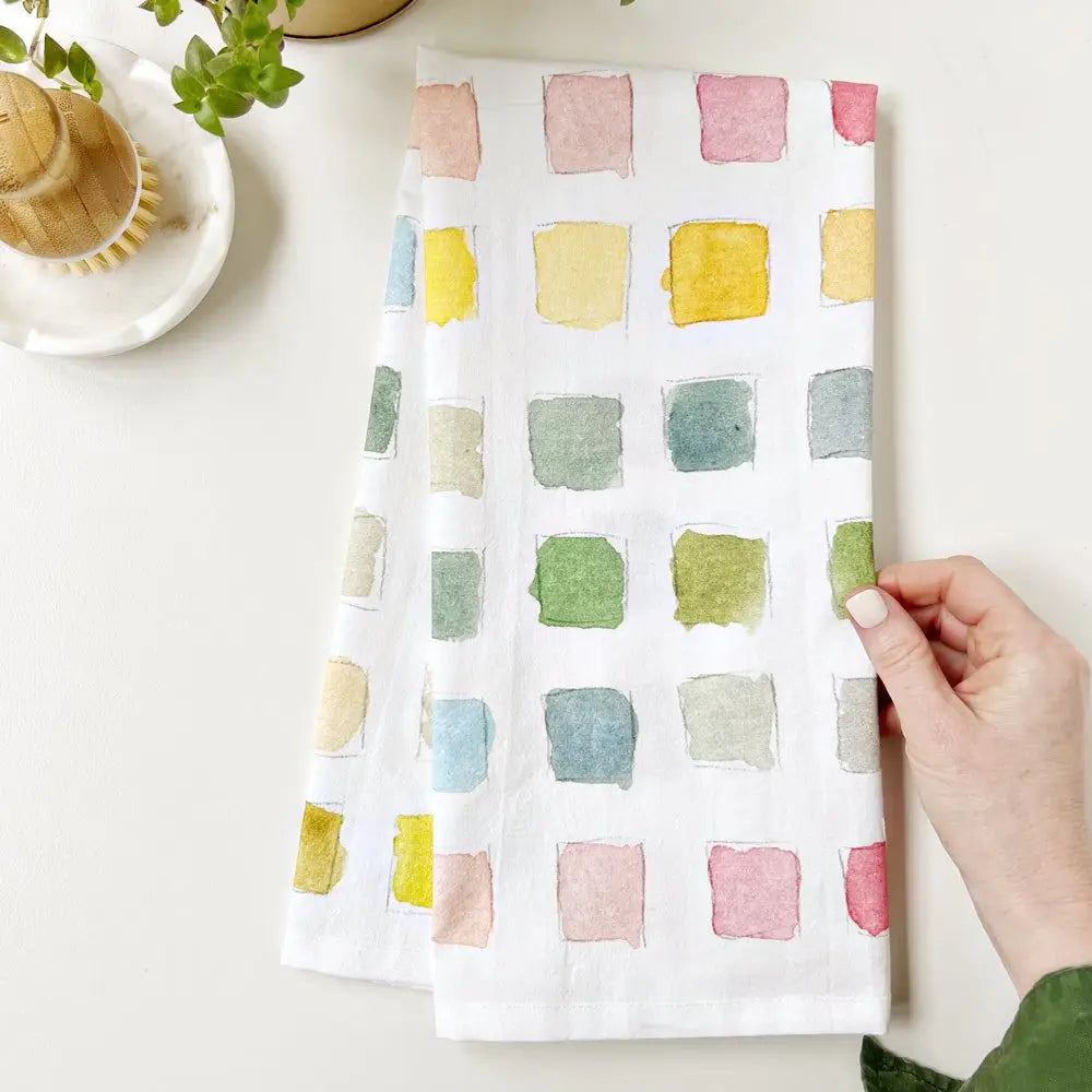 Emily Lex Paint Swatch Tea Towel with watercolor paint swatches in soft pastel tones