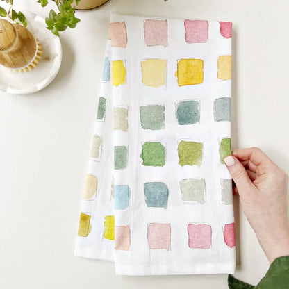 Emily Lex Paint Swatch Tea Towel with watercolor paint swatches in soft pastel tones