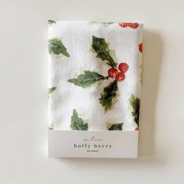 Emily Lex's holly berry tea towel displays the front side of its packaging.
