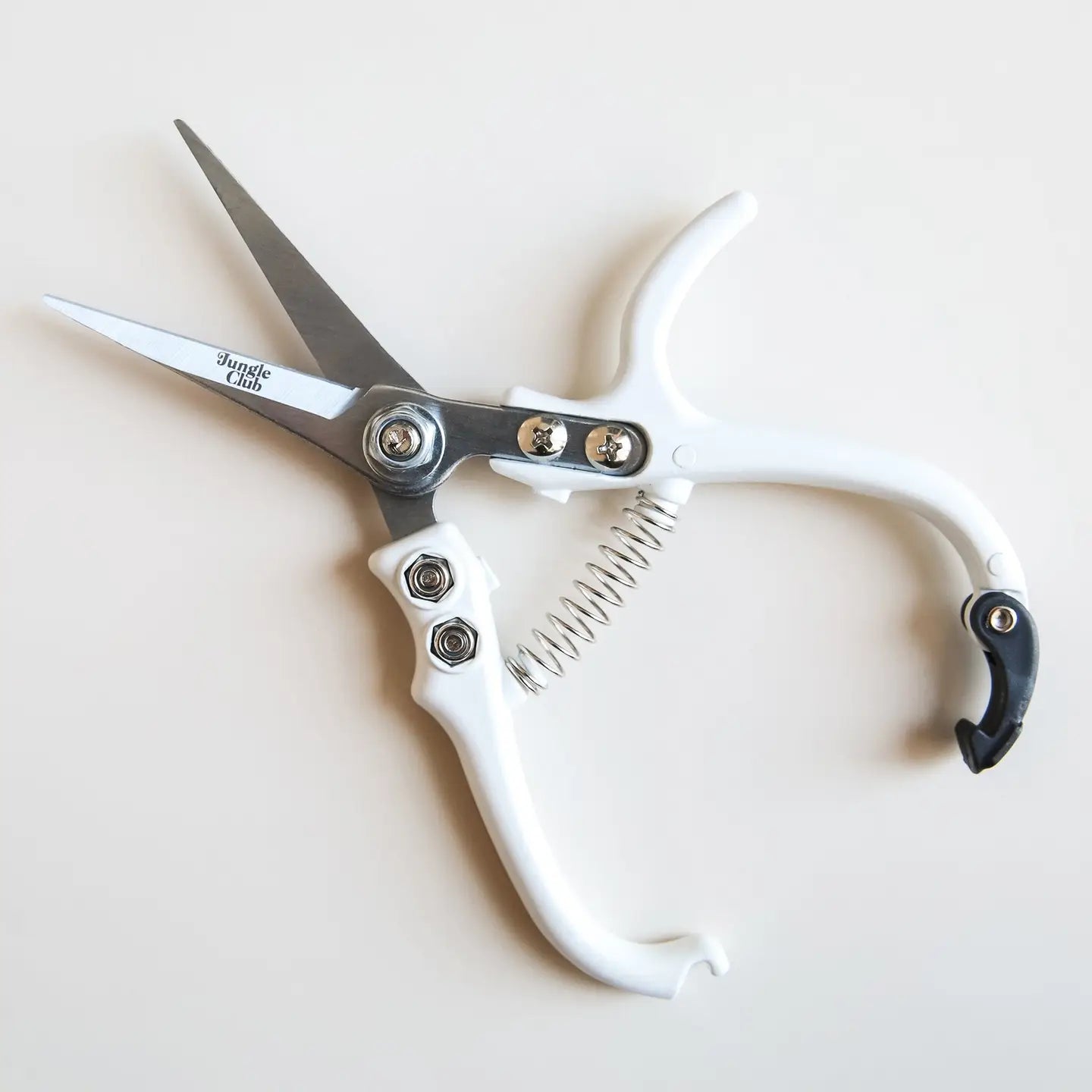 A lose up of the pruning shears in white.