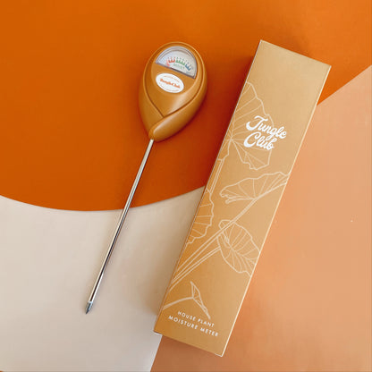 The Orange Moisture Meter shown with it's box.