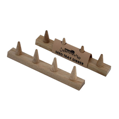 Two Creamore Mill Seed Tray Dibbers in natural oak shown from different angles on a white background