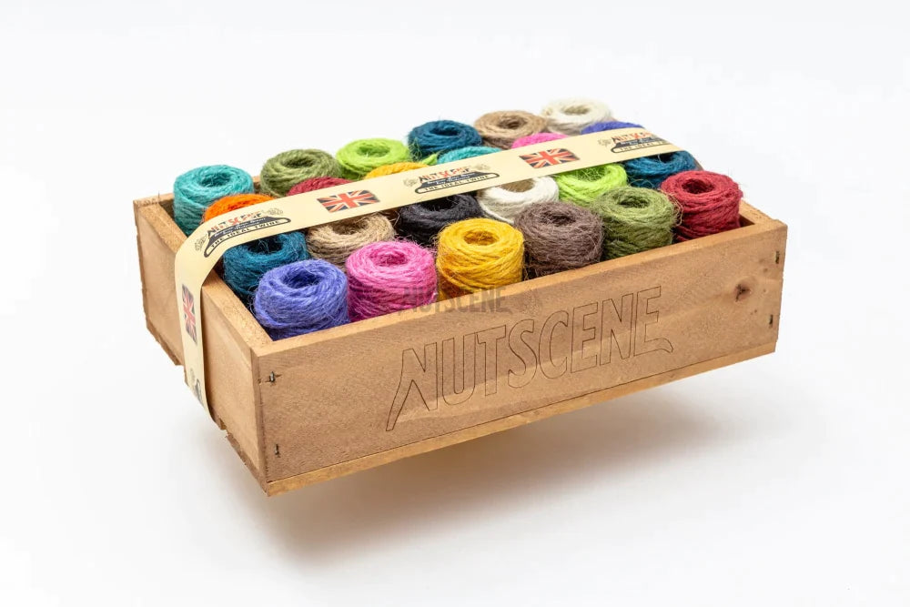 A side view of the wooden crate with the Nutscene colorful twine.