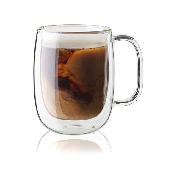 Image of the Zwilling Henckels Sorrento Glass Double Walled Coffee Mug with Coffee and Cream swirling in it. This image shows the double walled construction
