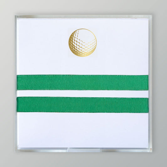 A picture of the gold embossed golf ball on stationery paper. This is a pad of 275 sheets tied with a ribbon.