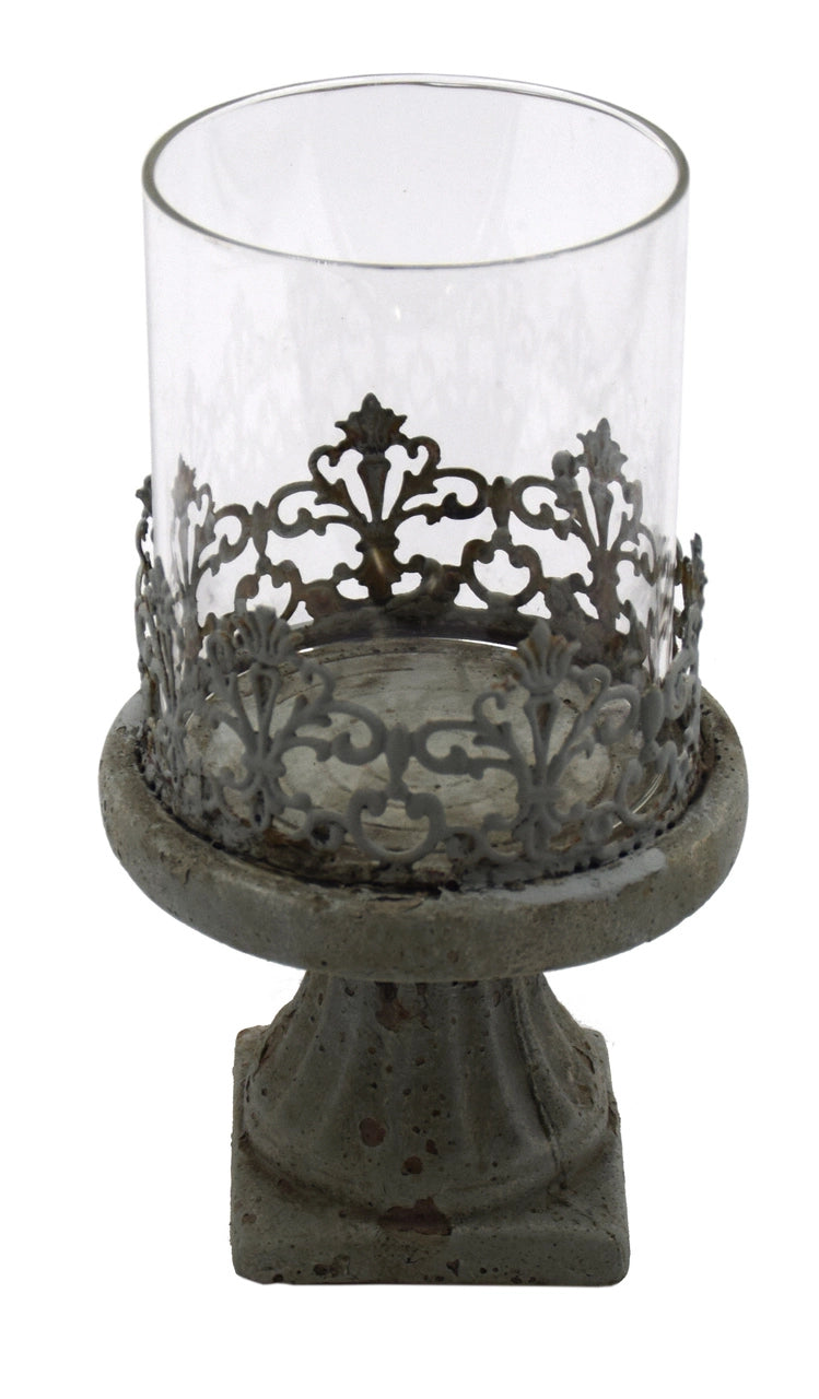 This is a black and white picture of the hurricane cement candle holder. It shows the detail of the filigree around the base of the glass chimney.