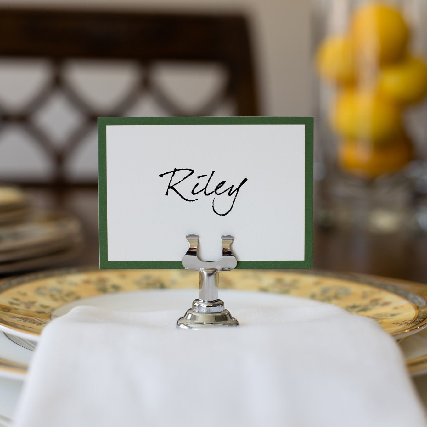 another example of the place holding a place card with a name written on it