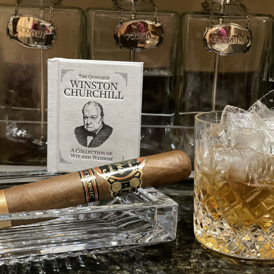 A picture of The Quotable Winston Churchill with his famous cigar and cocktail