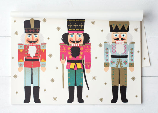 Nutcracker placemats. Three different nutcrackers are printed on this placemat in somewhat muted colors