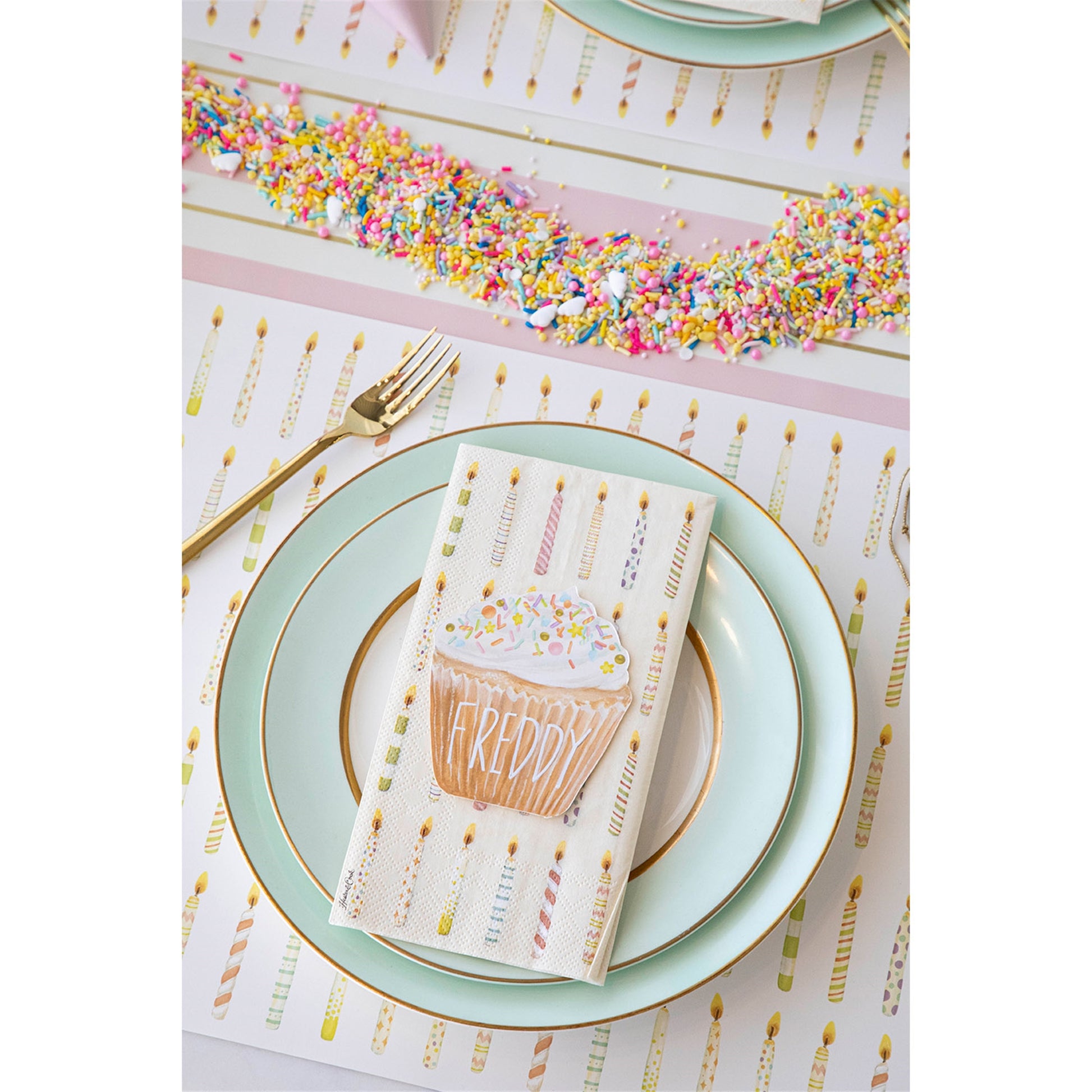 a photo showing how you can set the table using the birthday placemat and the cup cake place card.