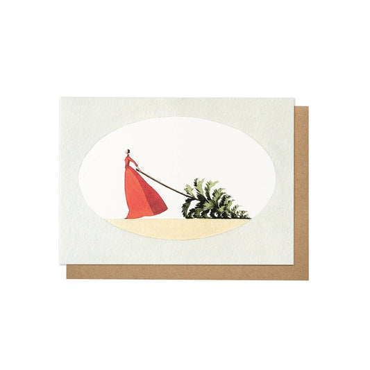 Mrs. Christmas Card, a woman in a red dress is dragging a Christmas tree behind her.