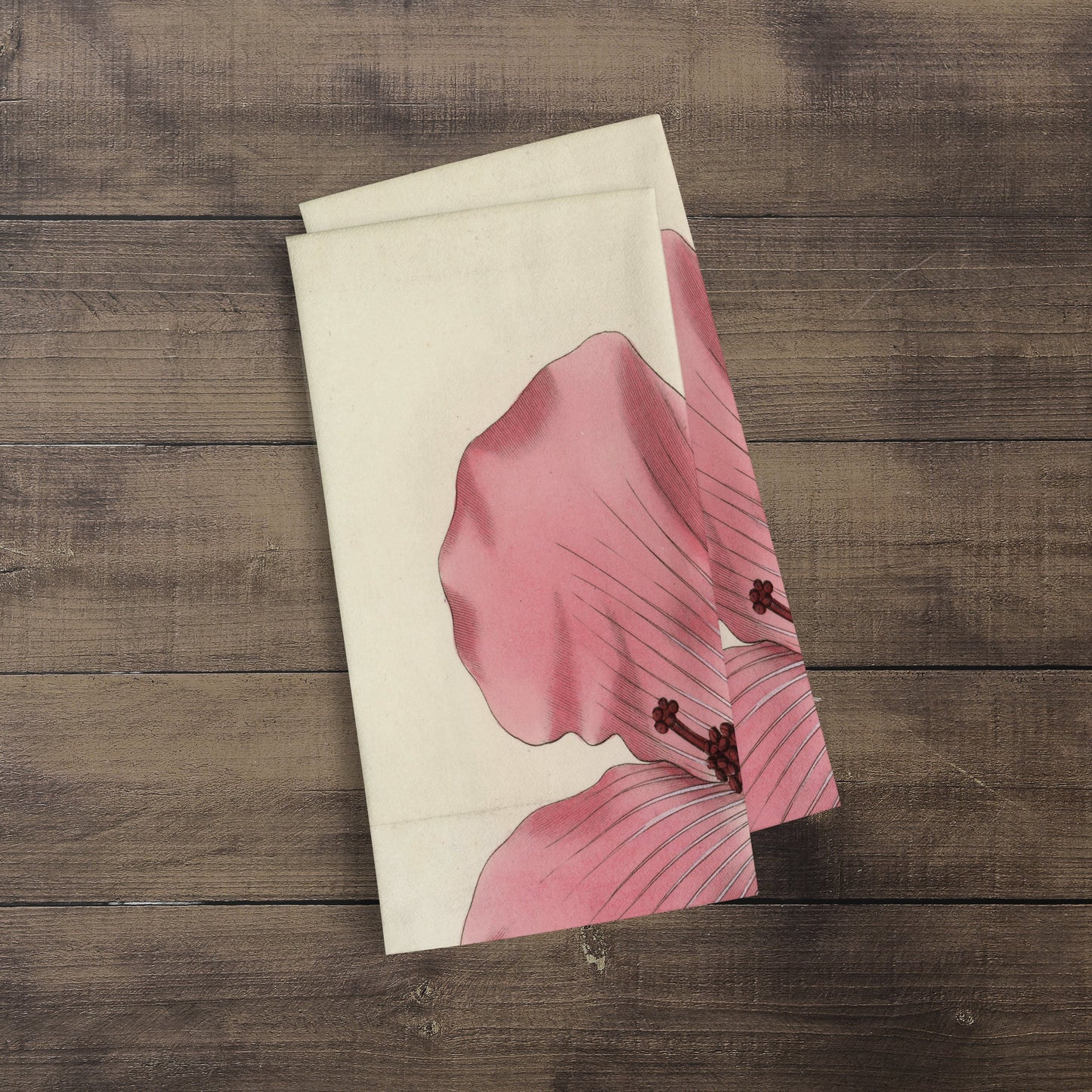 A photograph of the Hibiscus Botanical Print kitchen/tea towel folded over showing just part of the print. It is a William Curtis’s Print from 1790-1800