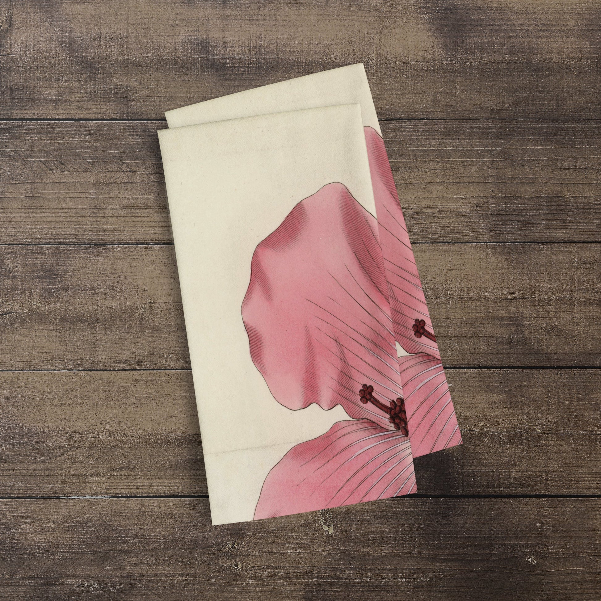 A photograph of the Hibiscus Botanical Print kitchen/tea towel folded over showing just part of the print. It is a William Curtis’s Print from 1790-1800