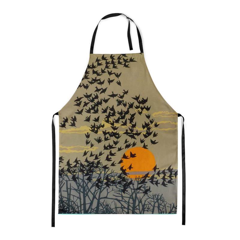 A picture of the Starlings Botanical Print Apron laid out so you can see the entire print.