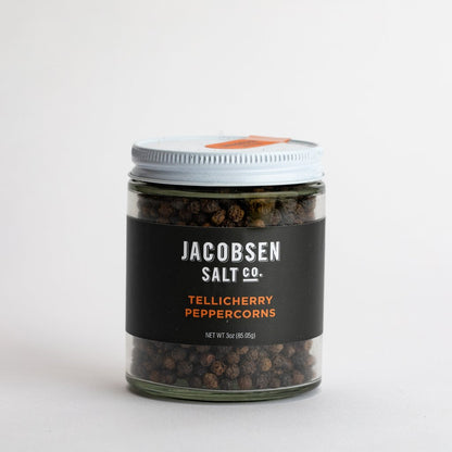 A picture of Jacobsen Salt co. Tellicherry Peppercorns in a 3 ounce glass jar.