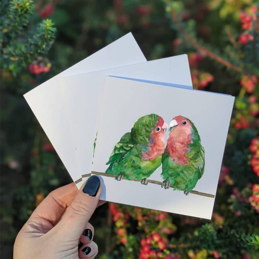 The sweetest watercolor of two little Love birds. These are mimi cards that are 4 x 4 inches.