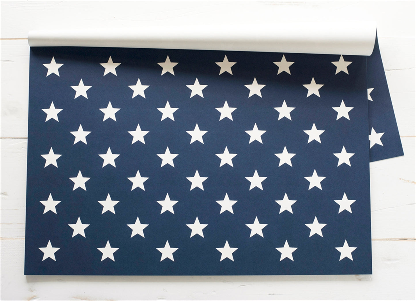 Disposable blue and white star placemats. Navy Blue background with White Stars. Great for patriotic holidays.
