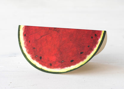 A picture of the folded watermelon place card. It looks just like a slice of watermelon.